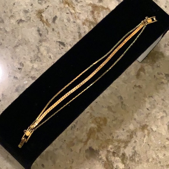 Monet gold tone triple strand chain bracelet